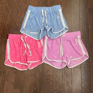 A bundle of girls shorts ( pink, purple, and blue)